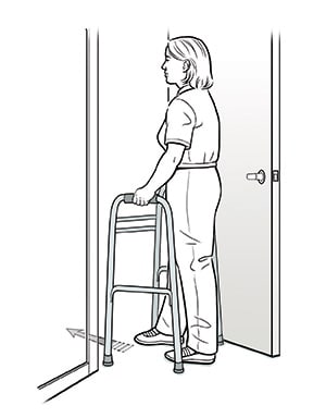 Female with walker moving through doorway. 